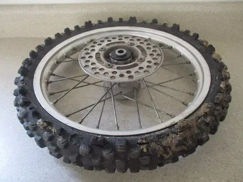 2005 KAWASAKI KX65 14" FRONT WHEEL RIM HUB COMPLETE, FITS ALL, M185