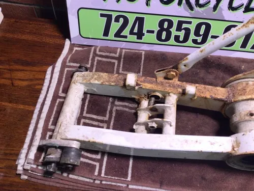 1986 SUZUKI QUADRUNNER 230 LT230E 2X4 OEM REAR SWINGARM BACK SUSPENSION CARRIER