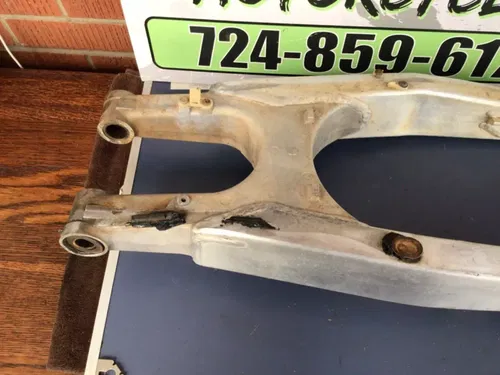 1997 97 CR250R CR250 OEM Swingarm Rear Suspension Wheel Brace Arm FOR REPAIR