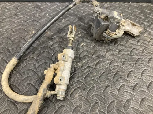 2002 02-15 RM85 RM85L OEM Rear Brake Caliper Bracket Master cylinder