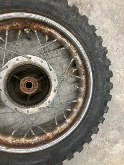 KTM SX 50 1997 10" FRONT WHEEL JR COMPLETE W/ tire rusty rim solid