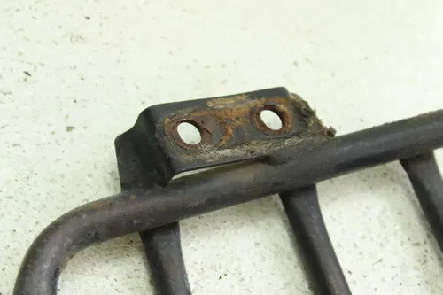 2000 Kawasaki Bayou 220 OEM Left Heel Guard  B4463