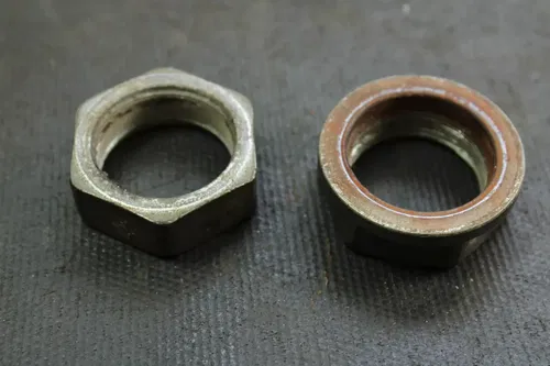 2000 Honda Recon 250 OEM Axle Locking Nut Set  B4433