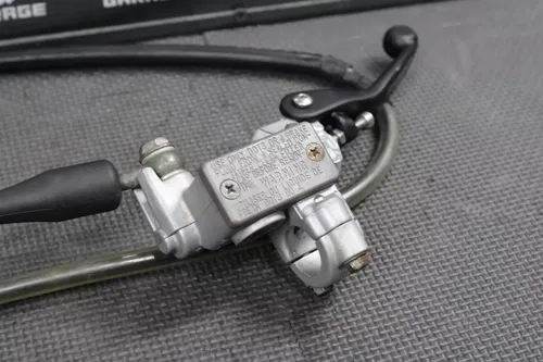 2004 KAWASAKI KX250 OEM NISSIN FRONT BRAKE CALIPER MASTER CYLINDER ASSEMBLY
