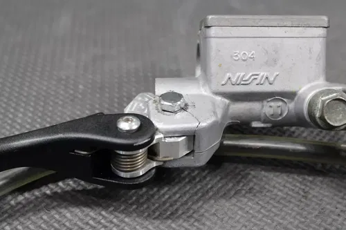2004 KAWASAKI KX250 OEM NISSIN FRONT BRAKE CALIPER MASTER CYLINDER ASSEMBLY