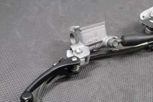2004 KAWASAKI KX250 OEM NISSIN FRONT BRAKE CALIPER MASTER CYLINDER ASSEMBLY