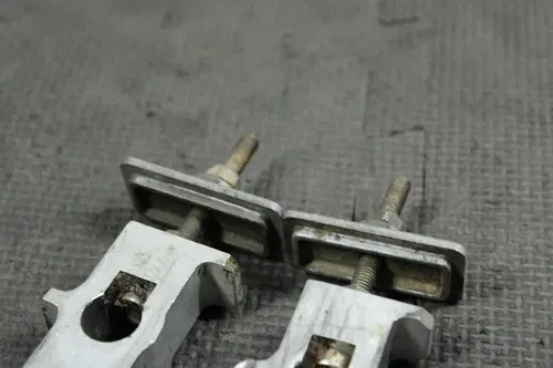 1998 SUZUKI RM80 OEM SWINGARM CHAIN TENSIONER ADJUSTMENT BRACKETS