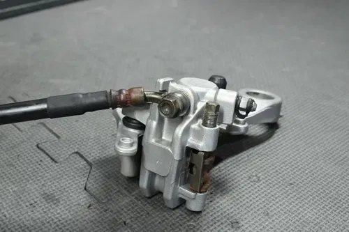 2007 05-09 HONDA CRF250R OEM REAR BACK BRAKE CALIPER MASTER CYLINDER LEVER