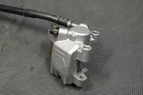 1999 SUZUKI RM250 OEM REAR BACK BRAKE CALIPER MASTER CYLINDER LEVER NEEDS WORK!