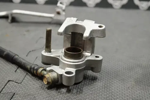 1999 SUZUKI RM250 OEM REAR BACK BRAKE CALIPER MASTER CYLINDER LEVER NEEDS WORK!