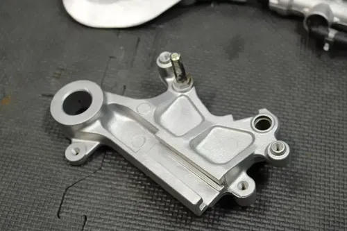 1999 SUZUKI RM250 OEM REAR BACK BRAKE CALIPER MASTER CYLINDER LEVER NEEDS WORK!
