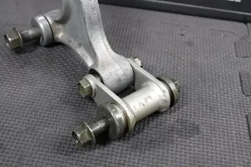 2002 YAMAHA TTR125 TTR125E OEM REAR SHOCK LINKAGE LINKS ARM ASSEMBLY