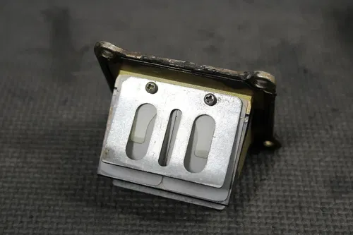1996 SUZUKI RM125 OEM INTAKE REED BLOCK ASSEMBLY 13110-36E01