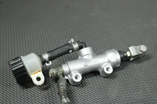 2001 99-01 KAWASAKI KX125 OEM REAR BACK BRAKE CALIPER MASTER CYLINDER LEVER GOOD