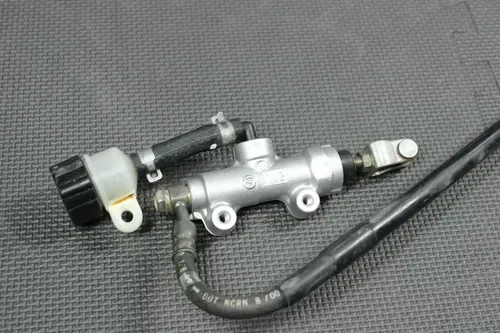 2001 99-01 KAWASAKI KX125 OEM REAR BACK BRAKE CALIPER MASTER CYLINDER LEVER GOOD