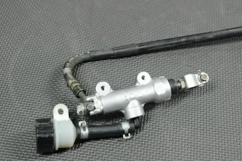 2001 99-01 KAWASAKI KX125 OEM REAR BACK BRAKE CALIPER MASTER CYLINDER LEVER GOOD