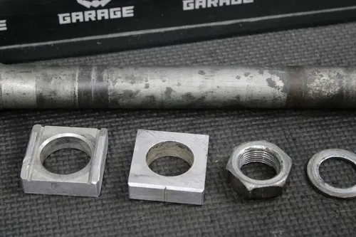 2006 HONDA CRF450R OEM REAR AXLE BACK WHEEL RIM PIVOT BOLT AXEL 42301-KZ4-J40