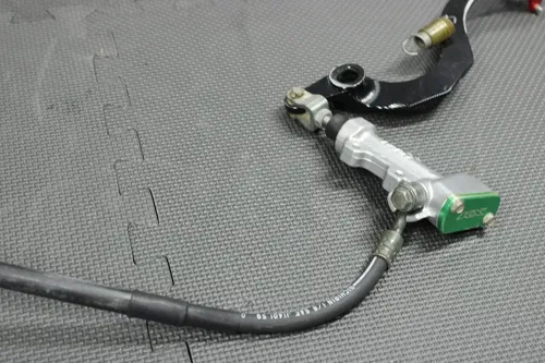 2006 KAWASAKI KX250F OEM REAR BACK BRAKE CALIPER MASTER CYLINDER NEEDS WORK!