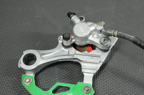 2006 KAWASAKI KX250F OEM REAR BACK BRAKE CALIPER MASTER CYLINDER NEEDS WORK!