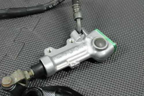 2006 KAWASAKI KX250F OEM REAR BACK BRAKE CALIPER MASTER CYLINDER NEEDS WORK!