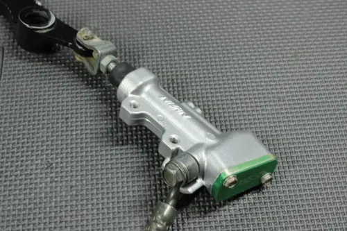 2006 KAWASAKI KX250F OEM REAR BACK BRAKE CALIPER MASTER CYLINDER NEEDS WORK!