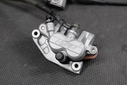 2009 KAWASAKI KX250F OEM NISSIN FRONT BRAKE CALIPER MASTER CYLINDER COMPLETE