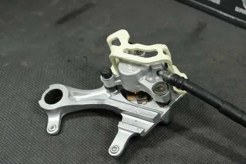2006 SUZUKI RMZ450 OEM NISSIN REAR BACK BRAKE CALIPER MASTER CYLINDER LEVER