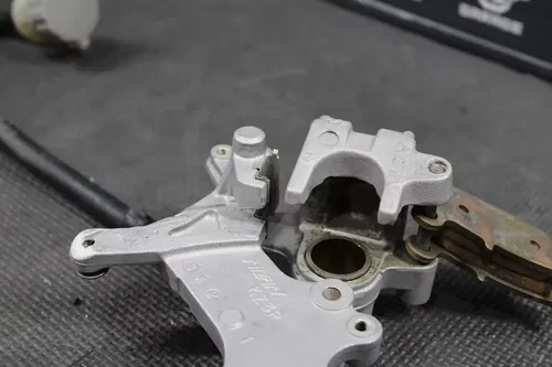 1997 HONDA CR250R OEM NISSIN REAR BACK BRAKE CALIPER MASTER CYLINDER LEVER
