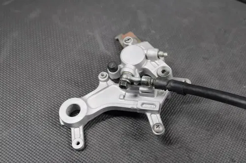 1997 HONDA CR250R OEM NISSIN REAR BACK BRAKE CALIPER MASTER CYLINDER LEVER