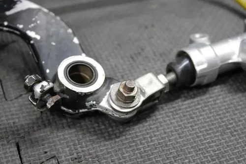 1997 SUZUKI RM250 OEM NISISN REAR BACK BRAKE CALIPER MASTER CYLINDER LEVER