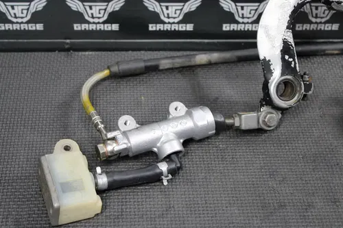 1997 SUZUKI RM250 OEM NISISN REAR BACK BRAKE CALIPER MASTER CYLINDER LEVER