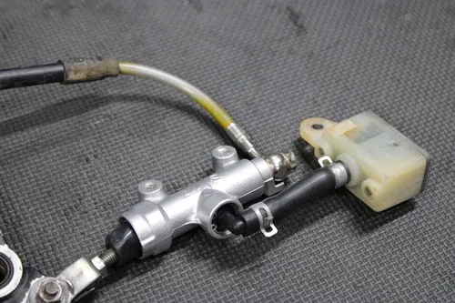 1997 SUZUKI RM250 OEM NISISN REAR BACK BRAKE CALIPER MASTER CYLINDER LEVER