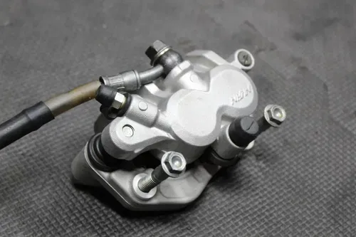 2006 HONDA CR125R CR250R CRF250R CRF450R OEM FRONT BRAKE CALIPER 45125-MEN-003