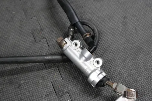 1989 HONDA CR125R OEM NISSIN REAR BACK BRAKE CALIPER MASTER CYLINDER LEVER