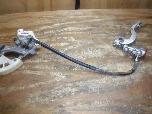 2010 RMZ250 Rear Brake Assembly Hose Line Caliper Master Cylinder