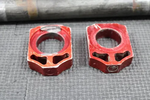 2006 HONDA CRF250R OEM REAR AXLE BACK WHEEL RIM PIVOT BOLT BLOCKS 42301-KZ4-J40