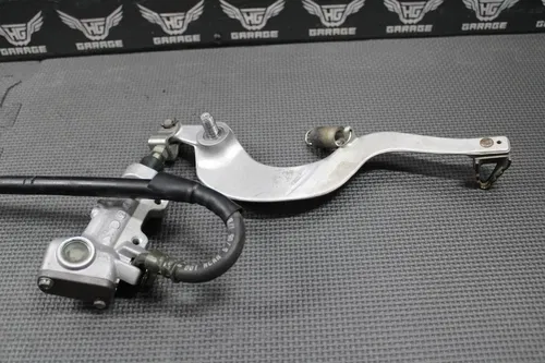 2006 05-07 KAWASAKI KX250 2 STROKE OEM REAR BRAKE CALIPER MASTER CYLINDER LEVER