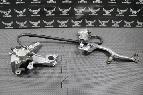 2006 05-07 KAWASAKI KX250 2 STROKE OEM REAR BRAKE CALIPER MASTER CYLINDER LEVER