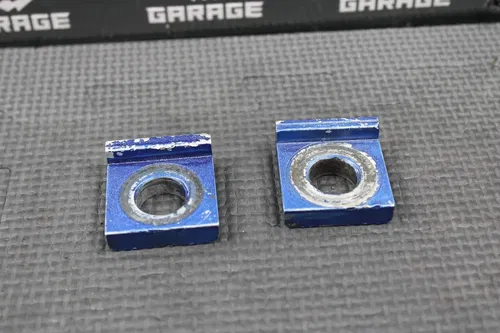 2005 SUZUKI 04-23 RM85 OEM REAR AXLE BACK WHEEL AXLE BLOCKS NUT 64711-03B70