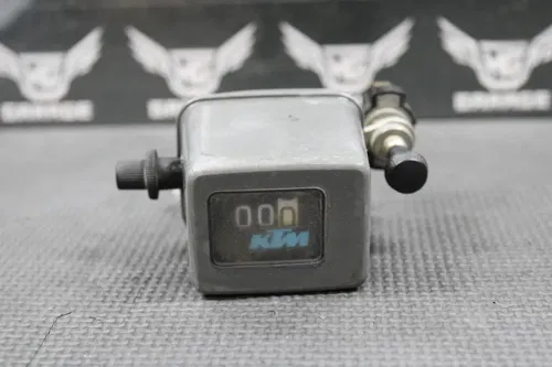 1995 KTM 250 EXC OEM ODOMETER MILE COUNTER & BRACKET 54611120200 58011180000