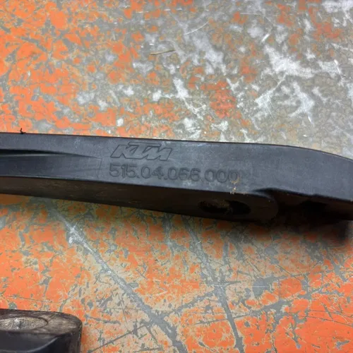 Swingarm Chain Slider Guide Guard 51504066000 150cc-500cc 2012-2023
