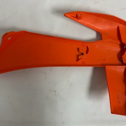 USED KTM LEFT SIDE TANK PLASTIC W/ NO GRAPHIC ORANGE 
