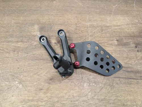 04-07 Honda CBR1000RR OEM Left Front Foot Peg Mount Guard - 50700-MEL-000