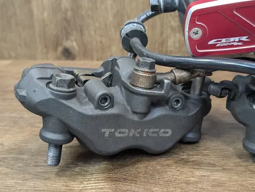 2005-2006 HONDA CBR 600RR OEM RIGHT LEFT FRONT BRAKE CALIPER SET PAIR CALIPERS