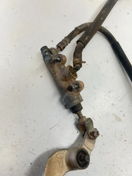 96 1996 Honda CR125R Cr 125 r OEM Rear Back Brake Caliper Master Mount FOR PARTS