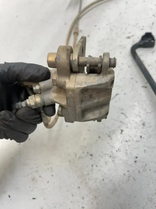 06 2006 Polaris Trail Boss 330 2x4 OEM GOOD! Rear Back Brake Caliper Master Cyl