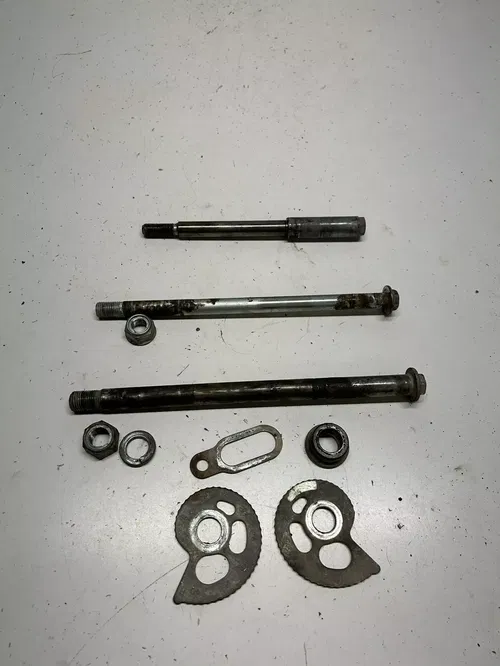 1984 84 Honda XL250R xl250r OEM LOT Front Rear Axle Shaft Swing Arm Bolt Adjust