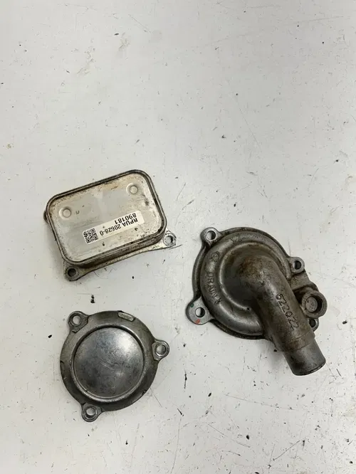 22 2022 Can-Am Maverick Sport 1000 Max OEM Oil Cooler Water Pump Cover Filter
