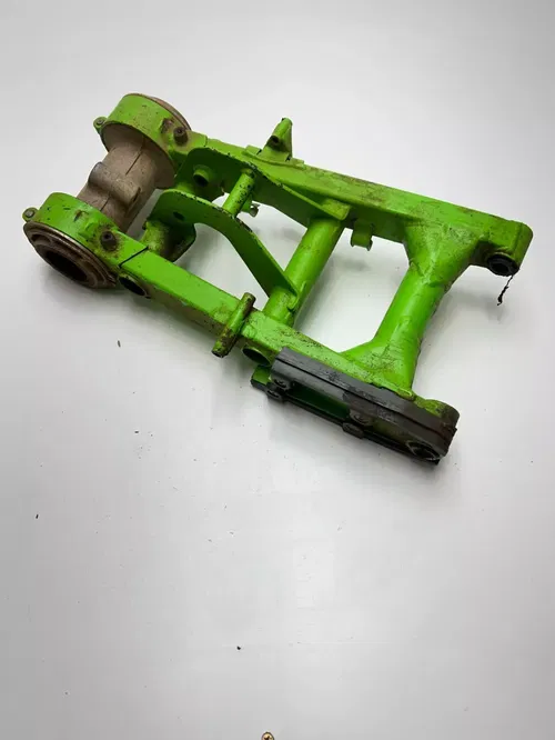 2000 Kawasaki Mojave 250 KSF250 OEM Swing Arm Axle Carrier Brake Mount Free Ship