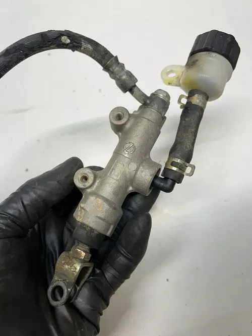 1999 99 Kawasaki KX125 Kx 125 OEM PARTS! Rear Back Brake Caliper Master Mount